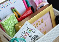 a white basket filled with lots of office supplies