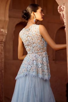 Powder blue peplum blouse with embroidered floral blossom motifs highlighted by sequins and beads. Comes with solid tiered hem lehenga and ruffle dupatta. - Aza Fashions Blue Floral Embroidered Tops For Wedding, Blue Floral Embroidery Tops For Wedding, Fitted V-neck Embroidered Top For Wedding, Blue Fitted Embroidered Top For Wedding, Fitted Peplum Dress With Intricate Embroidery, Elegant Embroidered Choli For Spring, Elegant Spring Choli With Intricate Embroidery, Sleeveless Floral Embroidered Top For Wedding, Elegant Embroidered Spring Choli