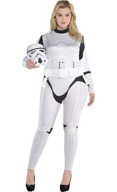 a woman in a star wars costume holding a helmet