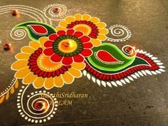 a colorful floral design on the ground for diwaling