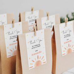 small brown bags with tags attached to them that say thank you for coming out of america