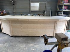 a large wooden counter sitting inside of a garage