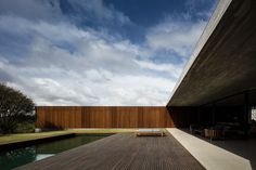 a wooden deck next to a body of water