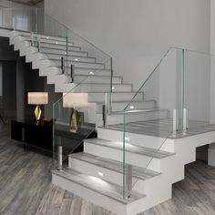 a staircase with glass balustrades in an empty room