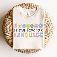 a white t - shirt with the words e is my favorite language printed on it