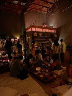 a group of people sitting around a table in a room