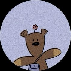 a teddy bear with a flower on its head sitting in the middle of a circle