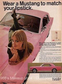 a woman leaning on the hood of a pink car with an advertisement for tussy