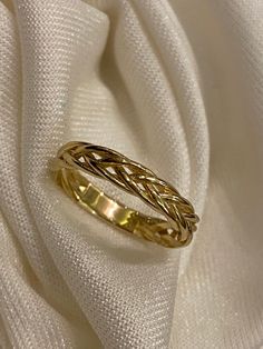 "ABOUT PRODUCT This 14K Gold Braided Ring is beautifully designed and hand crafted with our associates to make this a special gift for your loved ones. Knowing the value of our customers, We prepare each piece with extra care and attention. ITEM DETAILS Material: 14K Gold Approx: 2.20 gram Available colors: Gold, Rose Gold, White Gold Available Sizes: 3 US to 10 US Sizes ✪ 14k Solid Gold ( Certification will be included with your order ) ✪Available 14K White, Yellow, Rose Gold (also in 10, 18K) Handmade Yellow Gold Wedding And Anniversary Rings, Handmade Yellow Gold Anniversary Rings, Elegant Handmade Bands For Anniversary, Elegant Gold Resizable Braided Bracelets, Elegant Handmade Yellow Gold Engraved Ring, Elegant Handmade Engraved Yellow Gold Ring, Casual Gold Woven Jewelry, Gold Metal Braided Bracelet, Adjustable Gold Woven Braided Bracelet