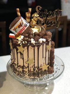 a birthday cake with chocolate frosting and candies