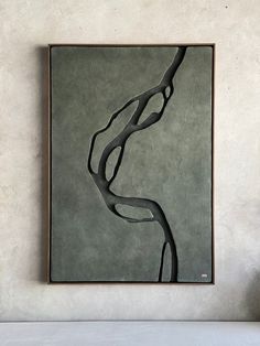 a painting hanging on the wall above a bed