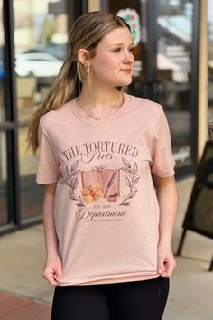 "The Tortured Poets Department" - established 2024 - Taylor Inspired T-Shirt

Heather peach color with pastel print

Bella + Canvas brand crewneck T-shirt

Unisex TTS fit.

99% Cotton / 1% Polyester

Alexis is 5'5" and is modeling a size Small.

*NOTE: If your size is out of stock and you'd like to order one, send us a message and we can special order a size for you! Pastel Print, Peach Color, Poets, Bella Canvas, Graphic Tee, Pastel, Canvas