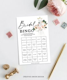 the bridal bingo game is next to some stamps and flowers