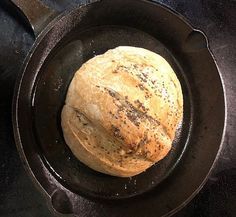 a loaf of bread sitting in a skillet