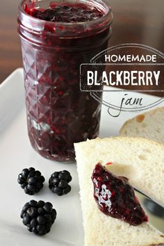 homemade blackberry jam in a mason jar with fresh blackberries on the side and spoon