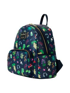 Loungefly x Harry Potter Herbology Mini Backpack Handbag Mandrake. Backpack features an all over print of herbology of Hogwarts. Features Rose Thorn, Valerian, Mandrake, Leaping Toadstool, Wormwood, Aconite Flower, Gillyweed, Wolfsbane potion, Asphodel, Devil's Snare, Mimbulus Mimbletonia, Puffapod, Dirigible plum, Earmuffs, Wand, and Dragonhide Gloves. Placement of all over print pattern will vary. Main compartment opens with a double zipper. Includes interior small zipper pocket. Front zipper Mimbulus Mimbletonia, Aconite Flower, Dirigible Plum, Wolfsbane Potion, Harry Potter Herbology, Backpack Fabric, Harry Potter Merchandise, Backpack Handbag, Platinum Credit Card