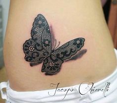 an image of a woman's stomach with a butterfly tattoo on the side of her belly