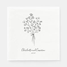 a wedding napkin with flowers on it and the words charlotte and charles written in black ink