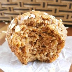 an oatmeal muffin sitting on top of a piece of wax paper