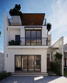 a white two story house with balconies and plants on the top level balcony