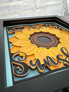 a sign that says swiff on it with a sunflower design in the center