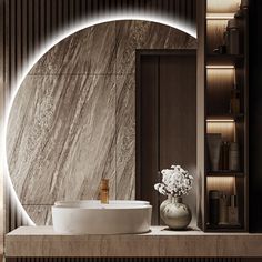 a bathroom with a round mirror above the sink and marble counter top next to it