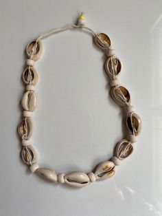 "Free Shipping  size: 16\"- 40cm Waterproof Handmade This is beautiful shell handmade necklaces, made from natural seashells .   Suit for  parties, Birthday parties, Beaches,  Wedding, or with many summer dresses.  Handmade." Adjustable Shell Necklace With Wooden Beads As Gift, Handmade White Shell Necklace, Handmade Adjustable Natural Shell Necklace, Natural Handmade Adjustable Shell Necklace, Natural Shell Necklace As Gift, Handmade Natural Shell Necklace For Gift, Natural Shell Necklace For Gift, Handmade Adjustable Natural Shell, Beach Beaded Necklaces With Wooden Beads In Beige