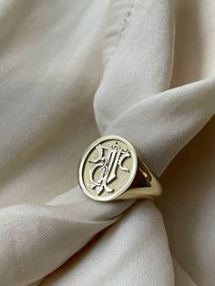 "custom gold monogram signet ring delicately engraved and personalized with your initials or any other image you want ♡ the ring has solid back. deep and detailed engraving very delicately handcrafted unisex - looks super cool on both women & men side or inside engravings cost 12 USD for both sides. please contact us if you request side engravins or simply go back to our shop and purchase the \"Side or inside engraving fee\" listing. available in 4 oval face sizes: small - 11x13 mm medium - 13x1 Signet Ring Design Ideas, Signet Ring Men Initials, Vintage Signet Ring Men, Initial Signet Ring, Signet Ring Initials, Elegant 14k Gold Engraved Initials Ring, Elegant 14k Gold Initial Ring With Engraving Option, Luxury Monogram Initial Ring, Luxury Personalized White Gold Initial Ring