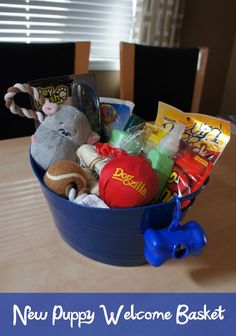 a blue bucket filled with toys on top of a table