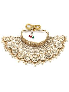 This jewelry set consists of a necklace, a pair of earrings, 2 hathphool bracelets and matha pattiGold-plated necklace has white kundan-studded and white pearls beaded detailsSecured with a drawstring closureA pair of matching drop earrings, each secured with a post-and-back closure2 matching hathphool bracelets, secured with a s-hook closureA matching Matha patti, secured with a hook closure Size & Fit Size of the necklace: 24 cm x 12 cm (Length x Width)Size of the earrings: 11 cm x 5.5 cm(Length x Width)Size of the Mathapatti: 11 cm x 23.5 cm(Length x Width)Size of the Hathphool: 13 cm x 16 cm (Length x Width) Material & Care Material: AlloyPlating: Gold-platedStone Type: Kundan and Beads Care InstructionsWipe your jewellery with a soft cloth after every useAlways store your jewellery in Adjustable Kundan Necklace With Tilla For Festivals, Adjustable Traditional Kundan Necklace With Stone Work, Traditional Adjustable Kundan Necklace With Stone Work, Traditional Adjustable Kundan Necklace With Tilla, Adjustable Kundan Necklace For Diwali, Adjustable Kundan Temple Jewelry Necklace For Diwali, Traditional Adjustable Kundan Necklace With Meenakari, Adjustable Temple Jewelry Kundan Necklace For Diwali, Traditional Adjustable Kundan Necklace For Diwali