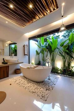 a bathroom with a large white bathtub sitting next to a sink