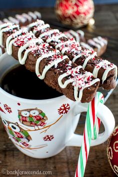 chocolate peppermint brownies in a mug with candy canes