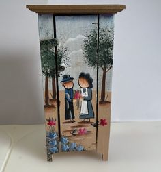 a wooden box with an image of two people standing next to each other