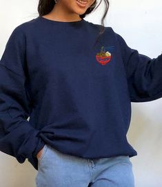 Cute ramen hand-drawn illustration embroidered on a crew-neck sweatshirt available in 10 colors!All sizes are unisex. Casual Crew Neck T-shirt With Custom Embroidery, Embroidered Crew Neck T-shirt For Streetwear, Multicolor Embroidered Text Crew Neck T-shirt, Anime Embroidery Sweatshirt, Ramen Shirt, Bella Canvas Tees, Drawn Illustration, Embroidered Sweatshirt, Embroidered Sweatshirts