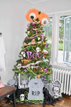 a decorated christmas tree in the corner of a room