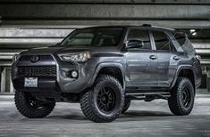 a gray toyota truck parked in a parking garage