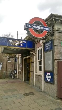 the entrance to underground railway station on a cloudy day with no one in it yet