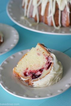 a piece of cake sitting on top of a white plate next to another slice of cake