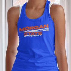 "Custom & Vintage Morgan State Bears HBCU College Apparel, Graphic Tees, Hoodies, Sweatshirts, and More Morgan State Apparel For Both Morgan State Students and Morgan State Alumni. Black owned, HBCU alumni operated apparel company specializing in academic wear. This Morgan State Bears product is handmade in Atlanta, GA with materials purchased from local Atlanta vendors. We use only the best material, printing, and packaging. Orders typically ship much faster than posted timeframes.  Ladies Tanks Are Relaxed Racerback Tanks (or regular/traditional size). Do Not order a size down because they are not baggy relaxed. Essentially the tanks just are not fitted (tight) to the body. If you would like a fitted style, please email us or add to the notes during checkout.  We Use Bella + Canvas (B640 Blue Racerback Top With Graphic Print, Sportswear Racerback Tops For Sports Events, Sportswear Tops For Sports Events With Racerback, Sleeveless Blue Tops For College, Sleeveless Team Spirit Tops For Streetwear, Collegiate Blue Sleeveless Tops, Collegiate Stretch Tops For Sports Events, Blue Sleeveless Collegiate Tops, Collegiate Moisture-wicking Gym Tops