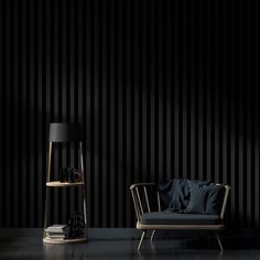 a chair and lamp in front of a black striped wall