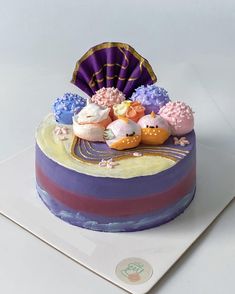 there is a colorful cake with decorations on it