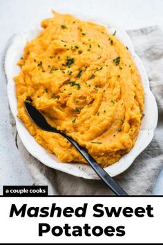 mashed sweet potatoes on a white plate with a black spoon in it and text overlay