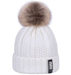 This knitted beanie cap featuring a stylish pom pom on top is made with an acrylic and cotton blend and lined with a faux fur lining to keep you stylish yet warm even during the coldest of days. Comes in 7 fab colors. Buy two together and save $4 using discount code POMPOMBEANIE at checkout. White Acrylic Hat For Fall, White Warm Beanie For Cold Weather, Warm White Beanie For Cold Weather, White Winter Beanie Cap, White Beanie Cap For Winter, White Warm Beanie For Winter, White Warm Winter Beanie, Warm White Winter Beanie, White Acrylic Winter Hat