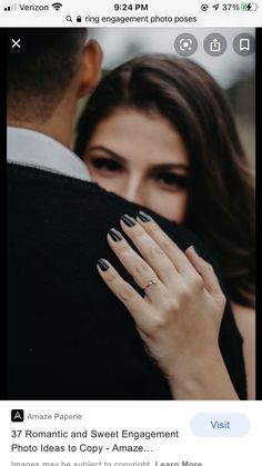 a man and woman embracing each other with their hands on the back of his shoulder