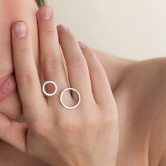 Negative Space Jewelry, Geometric Ring Designs, Adjustable Open Ring Minimalist Style, Minimalist Open Midi Rings For Promise, Modern Open Circle Promise Ring, Modern Hypoallergenic Sterling Silver Rings, Adjustable Gold Midi Rings For Anniversary, Modern Stackable Toe Rings For Promise, Modern Stackable Midi Rings For Everyday