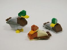 three lego ducks sitting next to each other