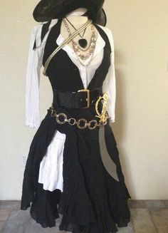 a black and white dress with chains on it