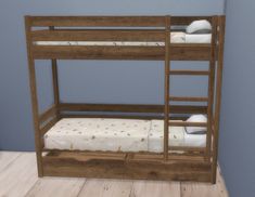 a wooden bunk bed sitting on top of a hard wood floor