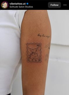 a person with a tattoo on their arm