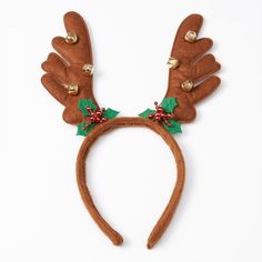 a reindeer antlers headband with bells and holly leaves on it's ears